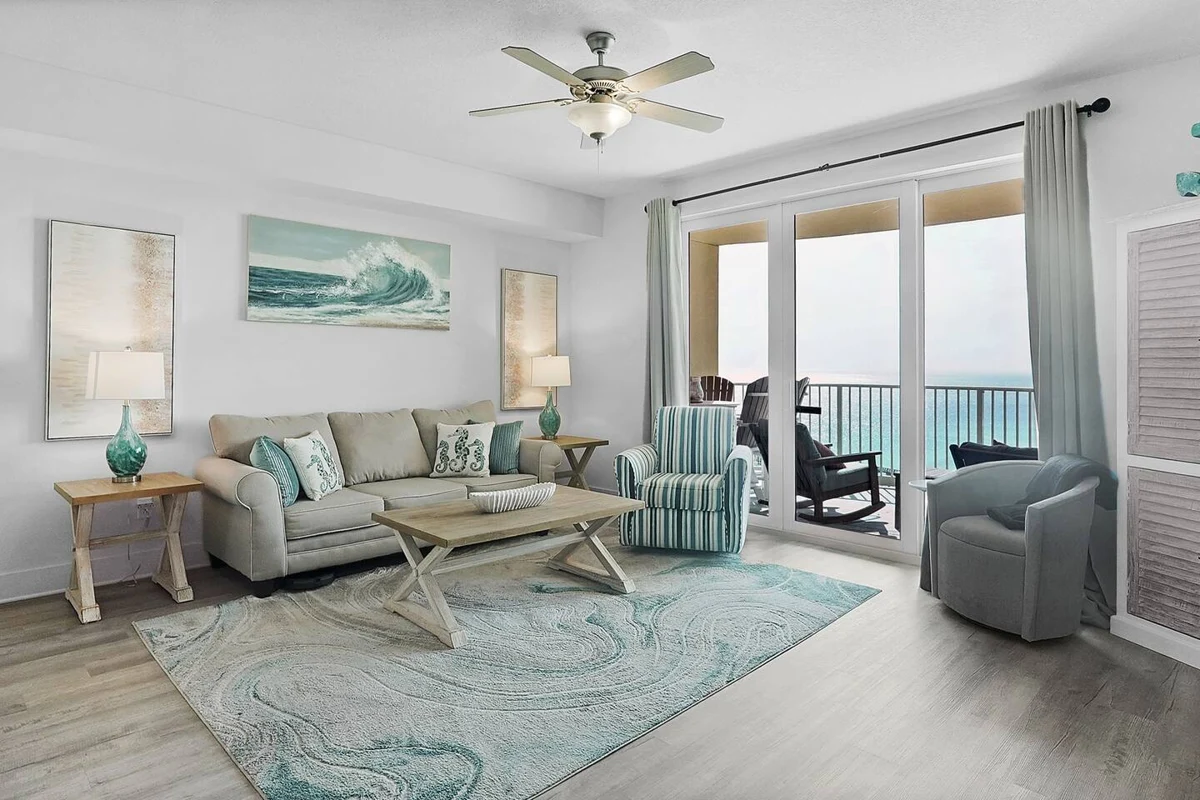 Bon Temps PCB living room with coastal furnishings and floor-to-ceiling balcony doors